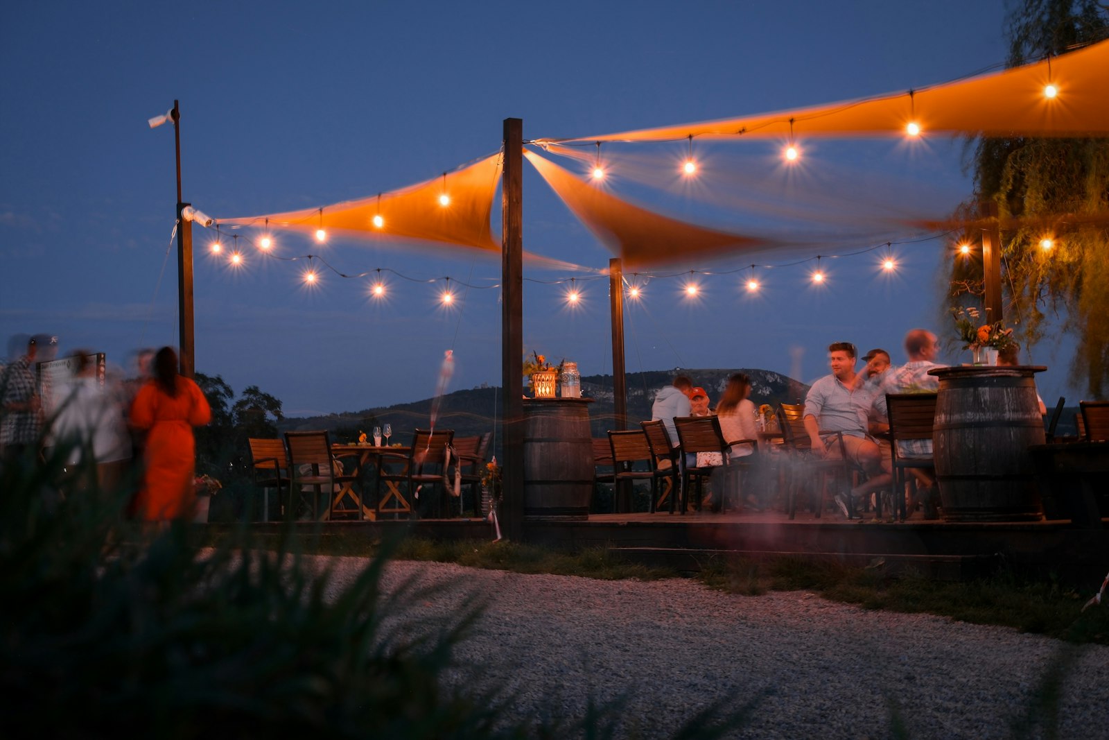 Outdoor restaurant patio with string lights at dusk